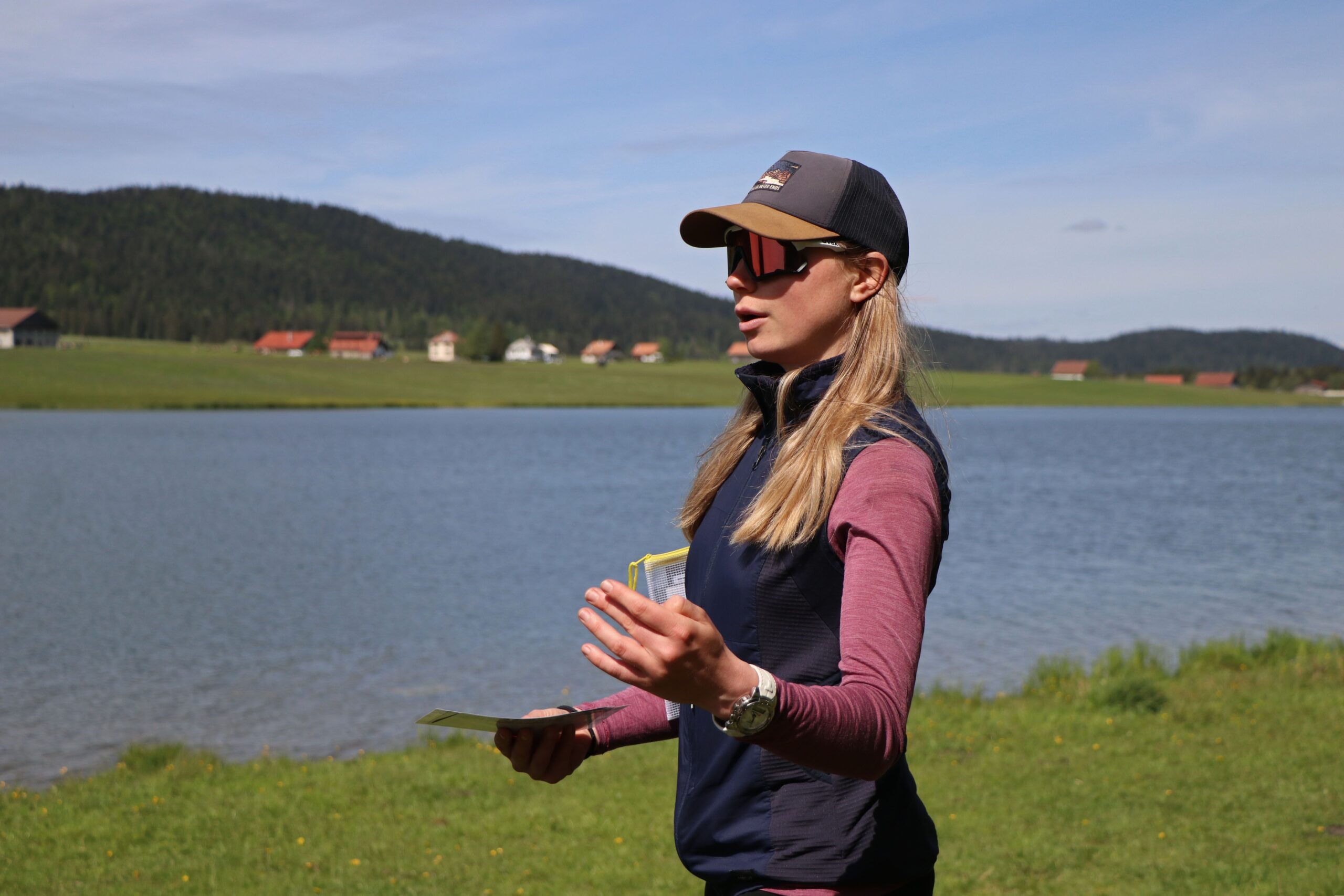 a group of trees covered in snow under a cloudy blue sky